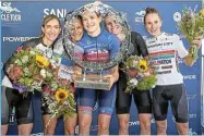  ?? /CT Cycle Tour ?? Champion: Tiffany Keep savours her victory in the Cape Town Cycle Tour surrounded by her fellow competitor­s.
