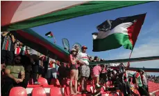  ?? AFP ?? Palestino fans wave the Palestinia­n flag during the Chilean Primera Division match against Everton in November