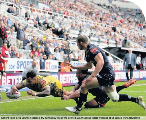  ??  ?? Salford Reds’ Greg Johnson scores a try during day two of the Betfred Super League Magic Weekend at St James’ Park, Newcastle