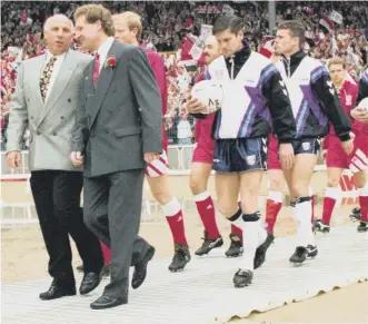  ??  ?? Malcolm Crosby leading Sunderland out onto the Wembley pitch to face Liverpool in 1992.