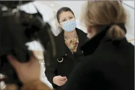  ?? LEWIS JOLY — THE ASSOCIATED PRESS ?? Plaintiff Sabrina Deliry answers reporters before the start of a hearing at the Paris Palace of Justice on Wednesday.