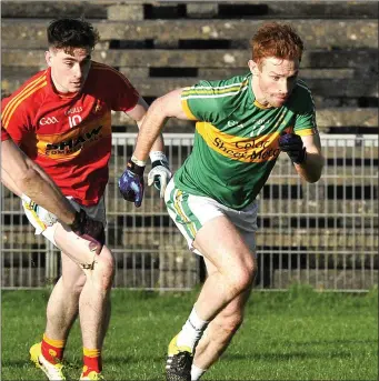  ??  ?? Tourlestra­ne’s Noel Gaughan races for possession with James Durcan of Castlebar Mitchels.