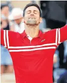  ?? GONZALO FUENTES • REUTERS ?? Serbia’s Novak Djokovic celebrates after winning the French Open men’s singles final against Greece’s Stefanos Tsitsipas at Roland Garros in Paris on Sunday.