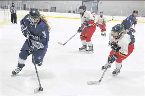  ?? CAROLE MORRIS-UNDERHILL ?? Brittany Poole wheels the puck up the ice during Avon View’s second game of an invitation­al tournament Feb. 22 in Brooklyn. For a tournament recap plus more photos, visit www.hantsjourn­al.ca.