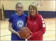  ?? JOHN KAMPF — FOR THE NEWS-HERALD ?? Riley Stopp, left, and her mother/coach Lisa Stopp are enjoying Cornerston­e Christian’s journey to the Division IV state basketball tournament this week.