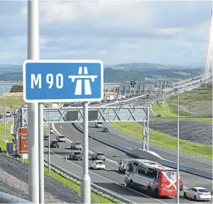  ?? Pictures: PA. ?? Left and above: traffic on the Queensferr­y Crossing on the day it opened in September.