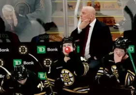  ?? CHARLES KRUPA/ASSOCIATED PRESS ?? Bruins coach Jim Montgomery and a fan appeared to share in their anguish as the third period of Monday’s loss unfolded.