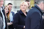  ?? AURORE MARECHAL/ABACA PRESS ?? Far-right French presidenti­al candidate Marine Le Pen meets with locals while touring the marketplac­e on Monday in Rouvroy, northern France.