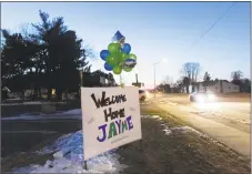  ?? Kerem Yucel / AFP / Getty Images ?? A “Welcome Home Jayme” sign displayed for Jayme Closs on Friday in Barron, Wis., one day after the missing teenager was found coming out of nearby woods with her hair matted and wearing oversized shoes.