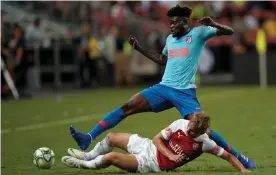  ?? Photograph: Allsport Co./Getty Images ?? Thomas Partey in action for Atlético Madrid against Arsenal during the Internatio­nal Champions Cup in 2018.