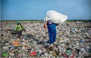  ??  ?? What are we doing?: Scavengers collecting valuable waste at a garbage dump in East Java. About eight million tonnes of plastic waste are dumped into the world’s oceans every year. — AFP