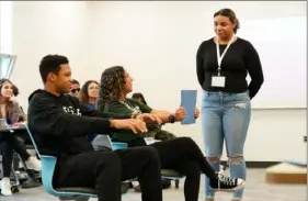  ?? ?? Steel Valley High School student Ricardo Scott, 15, left, Miley Madison, 16, of Belle Vernon and Carlynton High School student Nakiah Cloud, 18, act out a traffic stop scenario Friday during a workshop session on police relations during the Woodland Hills Student Summit.