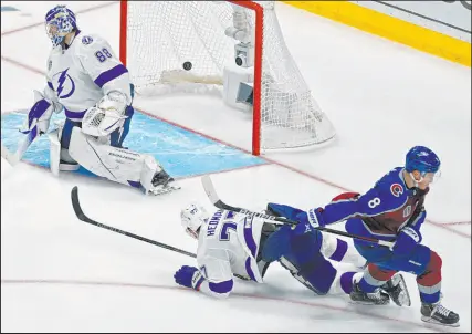  ?? John Locher The Associated Press ?? Cale Makar, scoring one of his two goals, and the Colorado Avalanche skated past the Tampa Bay Lightning with ease on Saturday, posting a 7-0 shutout to take a 2-0 lead in the Stanley Cup Final.