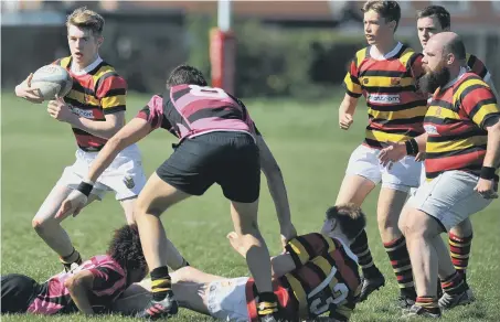  ??  ?? Sunderland (red and yellow hoops) attack against Whitby in Saturday’s defeat at Hill View. Pictures by Tim Richardson.