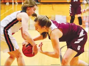  ?? Westside Eagle Observer/RANDY MOLL ?? Gravette sophomore Shylee Morrison battles for the ball against Gentry senior Jaydon Jarnagan during the Jan. 29 game at Gravette.