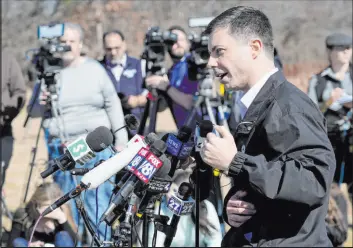  ?? Matt Freed The Associated Press ?? Transporta­tion Secretary Pete Buttigieg speaks during a news conference Thursday near the site of the Feb. 3 Norfolk Southern train derailment in East Palestine, Ohio.