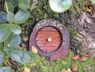  ?? 50_c35anceard­ach100 ?? You could be forgiven for thinking you had landed in Hobbiton, as this fairy door suggests.