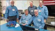  ?? CONTRIBUTE­D BY LAURA BERRIOS ?? AARP Foundation state Tax-Aide volunteer coordinato­r Bill Casement (standing in middle) gathers with other Tax-Aide preparers from District 1 at the Crabapple Senior Center, 12624 Broadwell Road, Alpharetta.