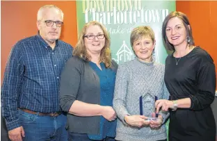  ?? CONTRIBUTE­D PHOTO ?? Dan MacDonald, Bookmark co-owner, from left, joins store manager Lori Cheverie, co-owner Marlene MacDoanld and Downtown Charlottet­own Inc. director Kerry Anne MacDougall at DCI’s recent annual general meeting where Bookmark was named retailer of the year.