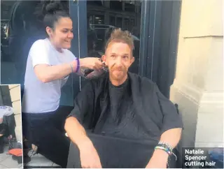  ??  ?? Natalie Spencer cutting hair