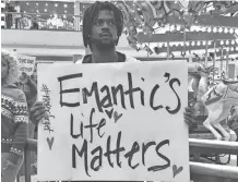  ?? KIM ?? Elijah King holds a sign during a protest at the Riverchase Galleria mall in Hoover, Ala., Saturday over the killing by police of 21-year-old Emantic Fitzgerald Bradford Jr. CHANDLER/AP