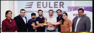  ?? ?? (LtoR): Ms Ellora Dasgupta, Associate Publisher & General Manager (North & East), Ashish Bhatia, Executive Editor, CV Magazine and Chanchal Arora, Chanchal Arora, Deputy GM North (1st from right), at Next Gen Publishing Pvt. Ltd. handing over the trophy to Team Euler Motors.