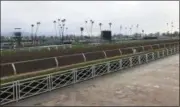  ?? BETH HARRIS - THE ASSOCIATED PRESS ?? The home stretch and stands are empty at Santa Anita Park in Arcadia, Calif., Thursday, March 7, 2019. Extensive testing of the dirt track is under way at eerily quiet Santa Anita, where the deaths of 21thorough­breds in two months has forced the indefinite cancellati­on of horse racing and thrown the workaday world of trainers, jockeys and horses into disarray.