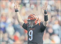  ?? AARON DOSTER – THE ASSOCIATED PRESS ?? Bengals quarterbac­k Joe Burrow, above, eclipsed Boomer Esiason’s single-game franchise record by passing for 525 yards in Sunday’s victory over the Ravens.