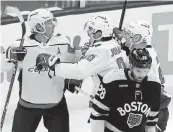  ?? MICHAEL DWYER AP ?? The Capitals’ Nicklas Backstrom, left, celebrates his goal with teammates during a 5-on-3 advantage.