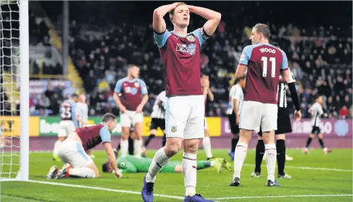  ?? Gareth Copley ?? Ben Mee reacts after a chance goes begging for Burnley in the home defeat against Newcastle on Monday