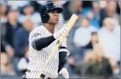  ?? ELSA/GETTY ?? Didi Gregorius of the New York Yankees watches his grand slam homer off Twins pitcher Tyler Duffey in the third inning.