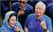  ?? REUTERS ?? Malaysia’s former PM Najib Razak and his wife Rosmah Mansor take part in the general election on May 9.