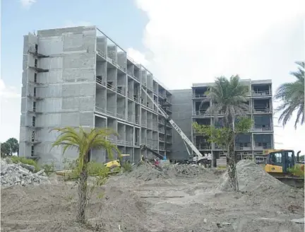  ?? JOE CAVARETTA/SOUTH FLORIDA SUN SENTINEL ?? A new apartment building is under constructi­on in Plantation, set to bring 330 more units to the market.