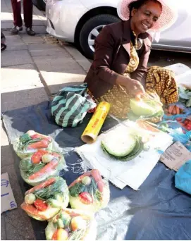  ?? ?? Mrs Felis Nyika, a vegetable vendor operating along Herbert Chitepo Street in Bulawayo’s CBD has become innovative in her trade. She sells an assorted vegetables pack that is made of cabbage, tomatoes, carrots, green beans, and onion to make an all-in-one package (Picture by Dennis Mudzamiri)