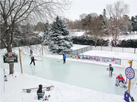  ?? BROWN FAMILY/IRON SLEEK ?? Backyard rinks can go from the shovel-and-hose variety to complex setups with full boards and refrigerat­ion systems.