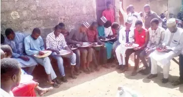  ??  ?? The youth counting the millet