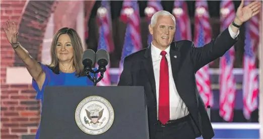  ?? SAUL LOEB/AFP VIA GETTY IMAGES ?? Vice President Mike Pence and wife, second lady Karen Pence, greet supporters Wednesday night at Fort McHenry in Baltimore, Maryland.