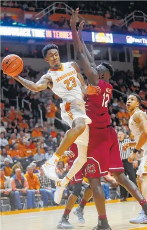  ?? THE ASSOCIATED PRESS ?? Tennessee guard Jordan Bowden drives against South Carolina forward Khadim Gueye in the first half of Tuesday’s game at Thompson-Boling Arena. The Vols won 70-67.