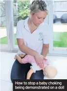  ??  ?? How to stop a baby choking being demonstrat­ed on a doll