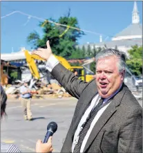  ?? AP FILE PHOTO ?? John Asher, vice-president of communicat­ions at Churchill Downs, talks about the history of the old paddock in Louisville, Ky., as general manager Ryan Jordan looks on, in August 2013.