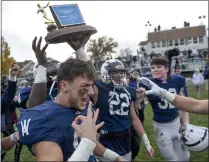  ?? JEREMY DREY — SPECIAL TO THE READING EAGLE ?? Wyomissing’s Aiden Mack, left, celebrates after the Spartans beat Boiling Springs 55-14to win their third straight District 3Class 3A championsh­ip.