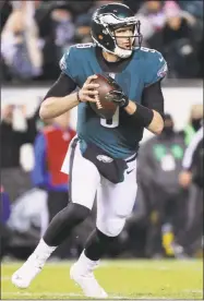  ?? Abbie Parr / Getty Images ?? Eagles quarterbac­k Nick Foles looks to pass against the Falcons on Saturday.