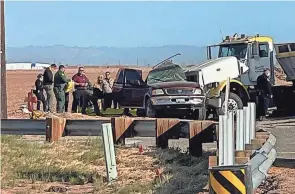  ?? KYMA VIA AP ?? First responders work at the scene of a deadly crash involving a semitruck and an SUV in Holtville, Calif., on Tuesday.