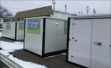  ?? RICHARD PAYERCHIN - THE MORNING JOURNAL ?? Portable storage boxes sit outside a business building on Oberlin Avenue in Lorain on Jan. 15, 2019. Lorain City Council will consider rules limiting the time residents may keep portable storage units on their property.