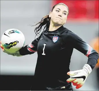  ?? Buda Mendes
Getty Images ?? HOPE SOLO, the U.S.’ goalkeeper, in action against the Chinese team in a December match in Brazil. Since returning to the team in February after a monthlong suspension, she has been playing in top form.