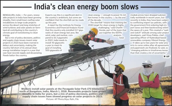  ?? Picture: AP Photo/Aijaz Rahi, File ?? Workers install solar panels at the Pavagada Solar Park 175 kilometres north of Bangalore, India, March 1, 2018. Renewable projects have grown steadily in India for years, but a mix of policy decisions, politics and supply chain issues have slowed progress on solar projects in 2023.
