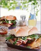  ?? CONTRIBUTE­D BY MARY BRITTON SENSENEY ?? These ham and havarti sandwiches are sweetened with a peach-mustard spread.