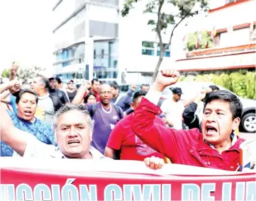  ?? — Reuters photo ?? Demonstrat­ors protest against Garcia near the residence of the Uruguayan ambassador in Peru, where the former President is seeking asylum, according to Peru’s government, in Lima, Peru.