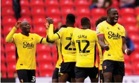  ?? ?? Watford players celebrate after Keinan Davis makes it 3-0, with Vakoun Bayo adding a fourth late on. Photograph: Nick Potts/PA