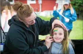  ?? SUBMITTED PHOTO - DENNIS KRUMANOCKE­R ?? Harlowe Wagaman smiles during her face painting session.